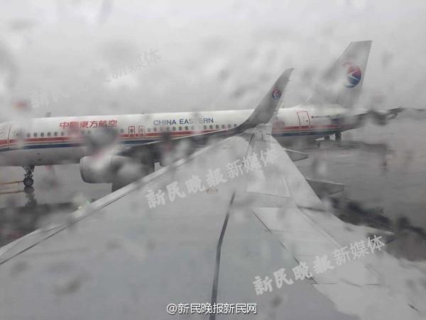 上海虹桥机场两架东航客机机翼发生碰擦。